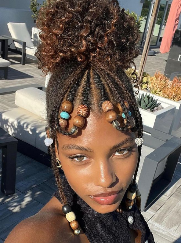Cornrow Braids Into High Loose Bun With Curly Clip-Ins